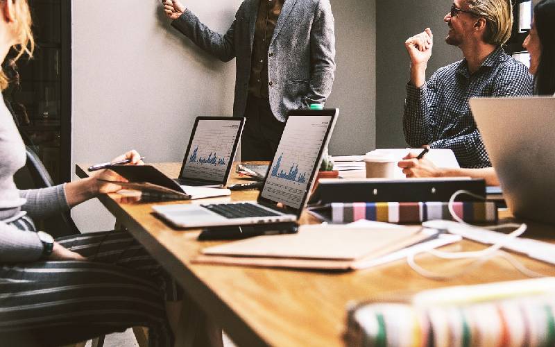 Workers collaborating on a project in a conference room